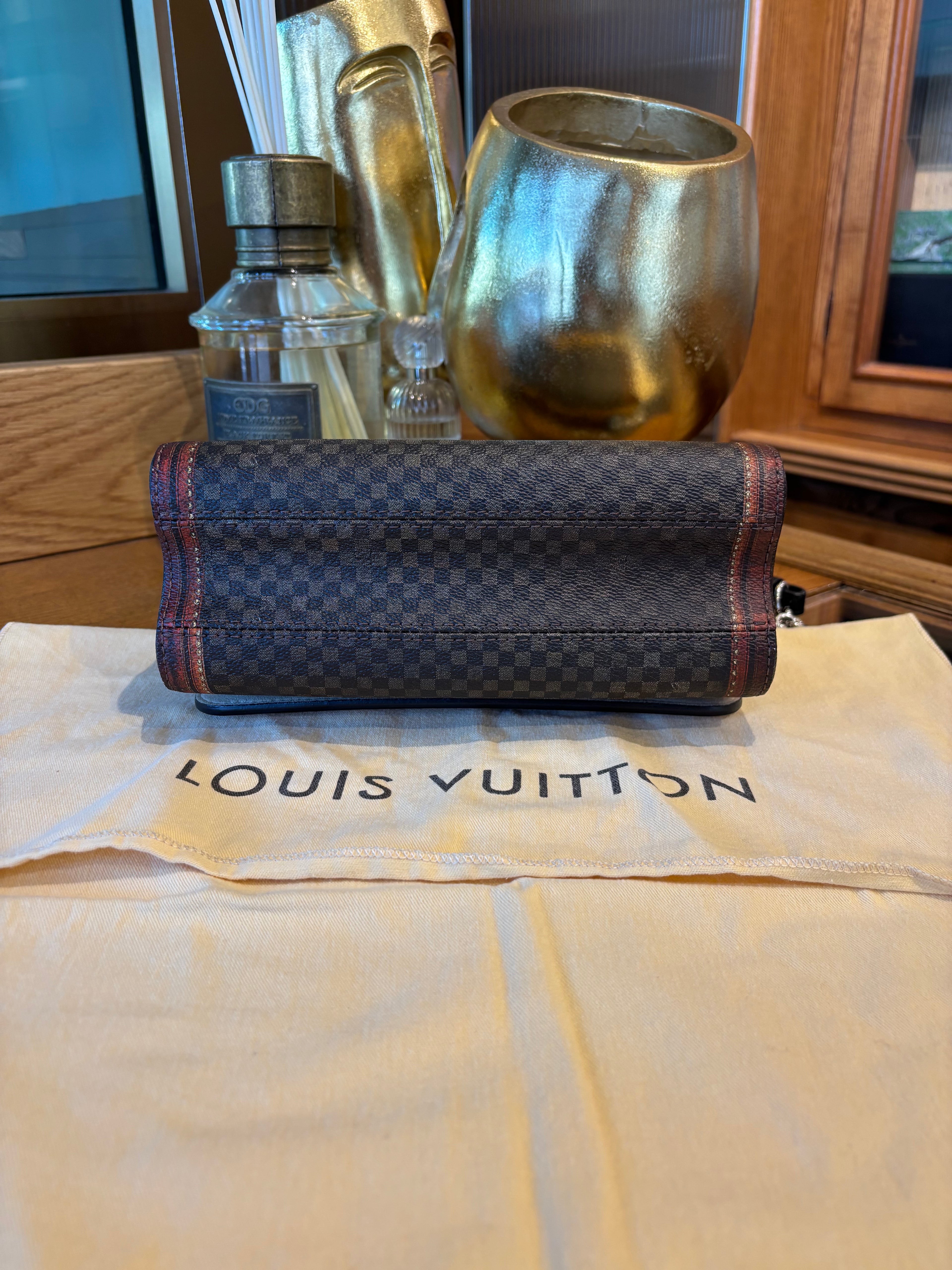 Louis Vuitton Damier Time Trunk Twist.